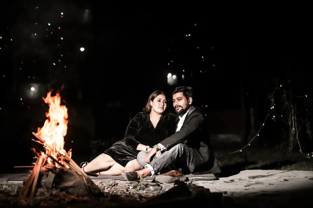 Cinematic pre-wedding night campfire shoot with radiant couple by Wedding Shedding