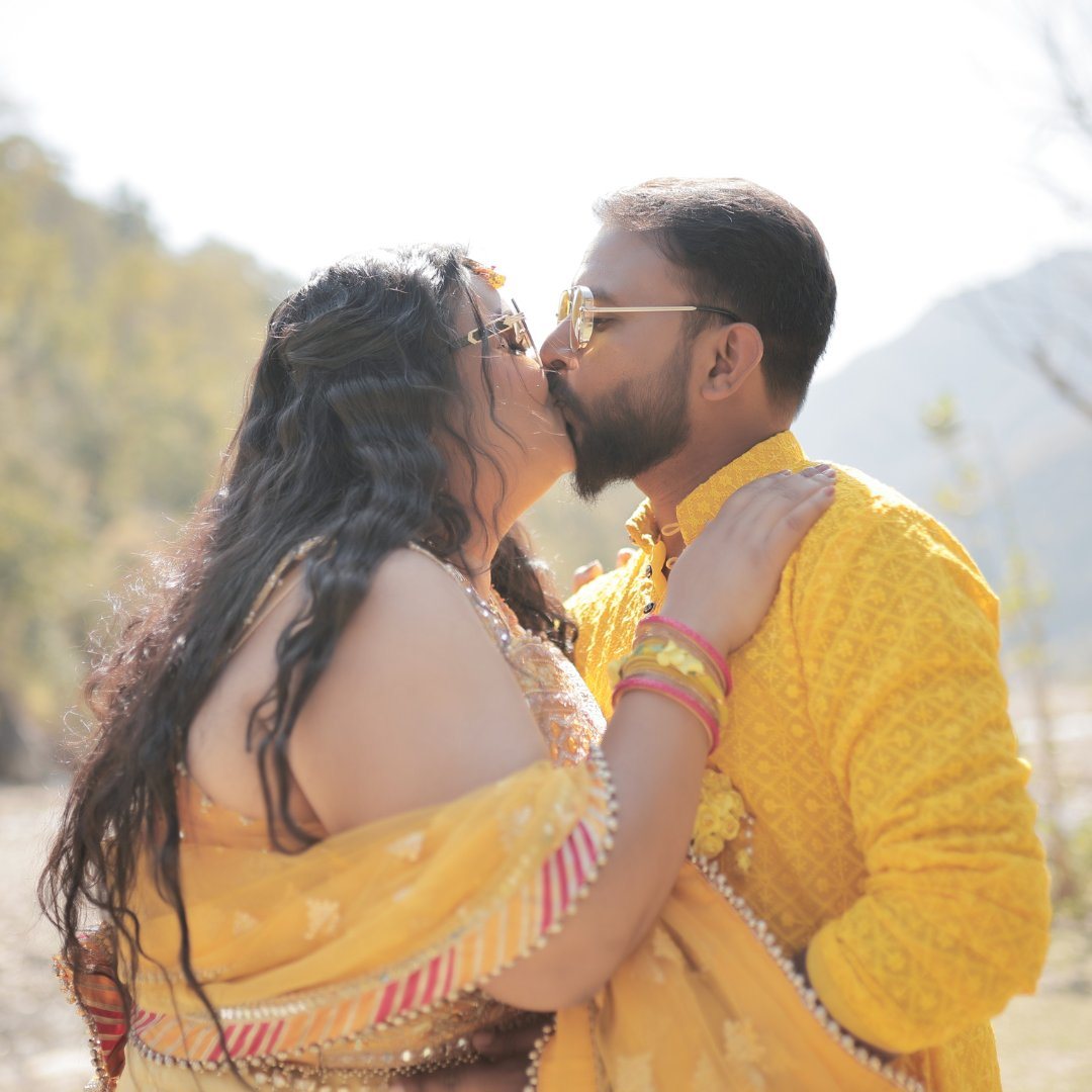 Vibrant Haldi Couple with Sunglasses by Wedding Shedding