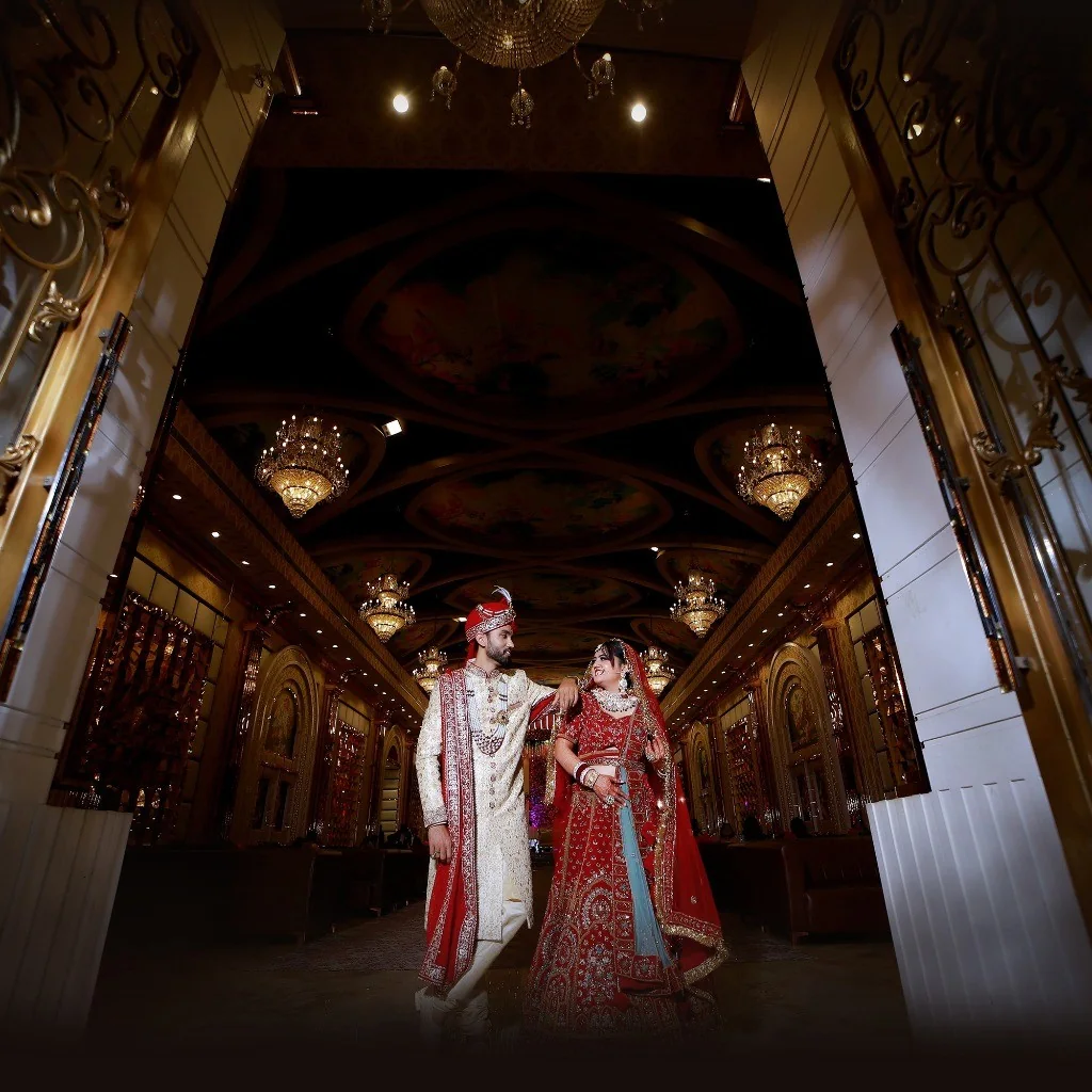 Majestic palace ballroom with crystal chandeliers and royal couple by Wedding Shedding