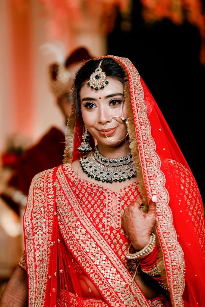 Sacred Vedic Royal Bride in Red Lehenga with Emeralds by Wedding Shedding